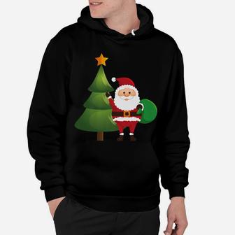 Santa Claus By Christmas Tree With Gifts Hoodie | Crazezy